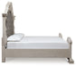 Bruchandi King Upholstered Panel Bed with Mirrored Dresser
